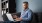 a man sitting on a couch with a laptop