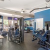 fitness center with rows of treadmills and modern style flooring